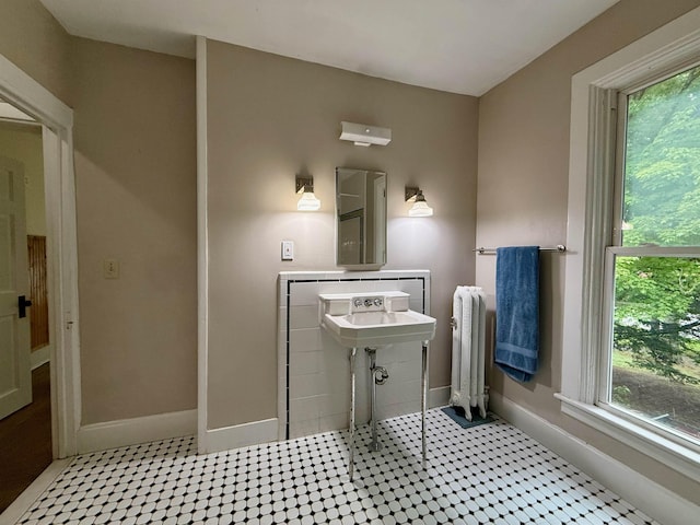 927 Water St, Bennington, VT 05257 - bathroom featuring radiator and baseboards