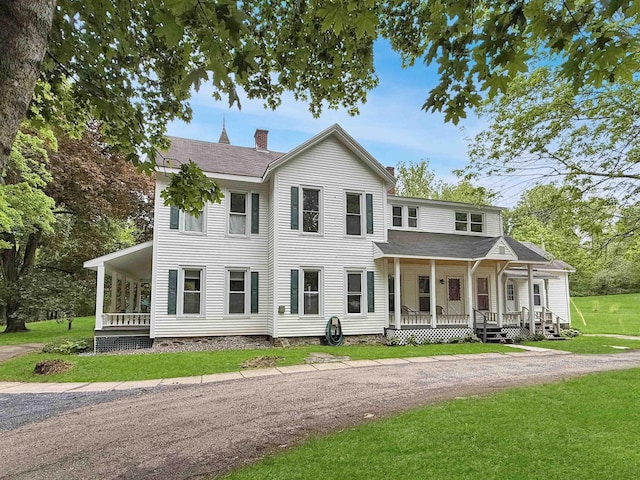 927 Water St, Bennington, VT 05257 - view of front of property featuring covered porch, a chimney, a front yard, and a shingled roof