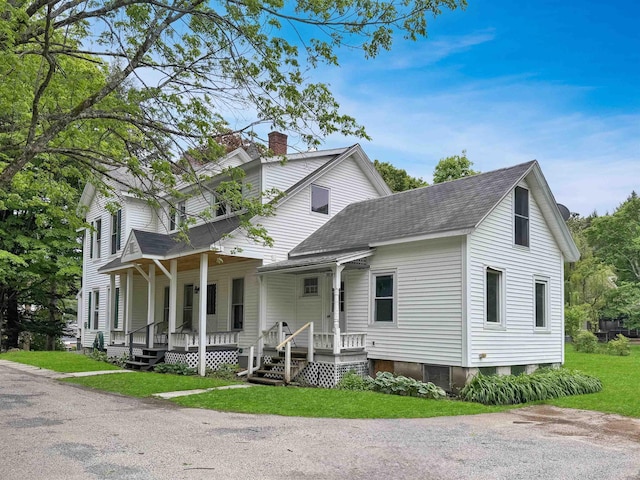 927 Water St, Bennington, VT 05257 - view of front of home featuring a shingled roof, a chimney, a porch, and a front yard