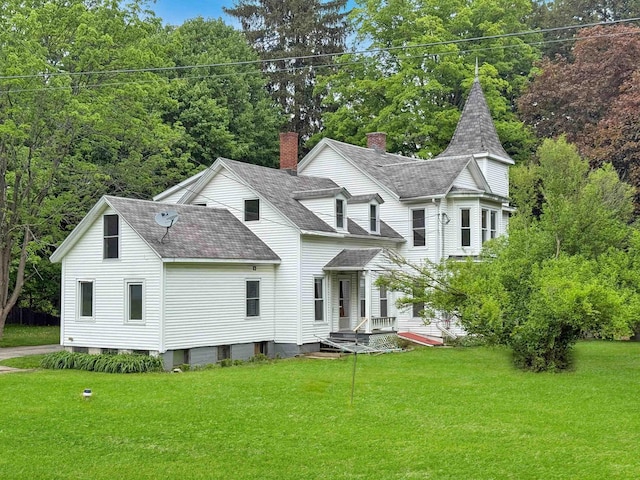 927 Water St, Bennington, VT 05257 - rear view of house with a shingled roof and a lawn