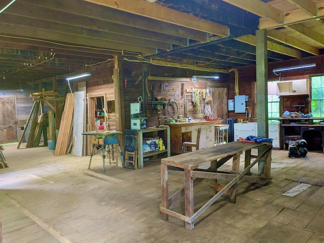 927 Water St, Bennington, VT 05257 - below grade area featuring a workshop area, electric panel, and wooden walls