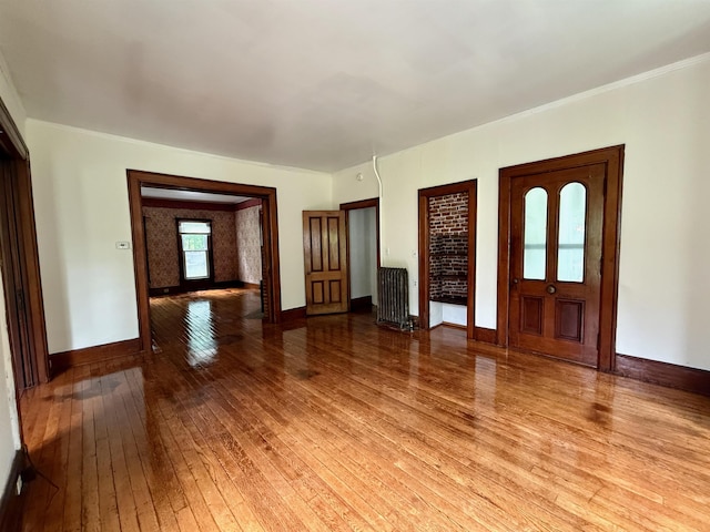 927 Water St, Bennington, VT 05257 - foyer featuring radiator heating unit, light wood-type flooring, and baseboards