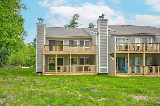 22 Northbrook Cir Unit 12, Conway, NH 03860 - rear view of house with a chimney, a deck, and a yard