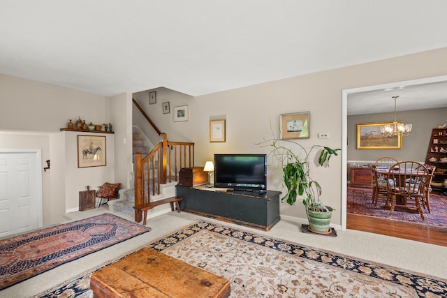 55 Honey Hill Rd, Hinesburg, VT 05461 - carpeted living room featuring stairs, a chandelier, and baseboards
