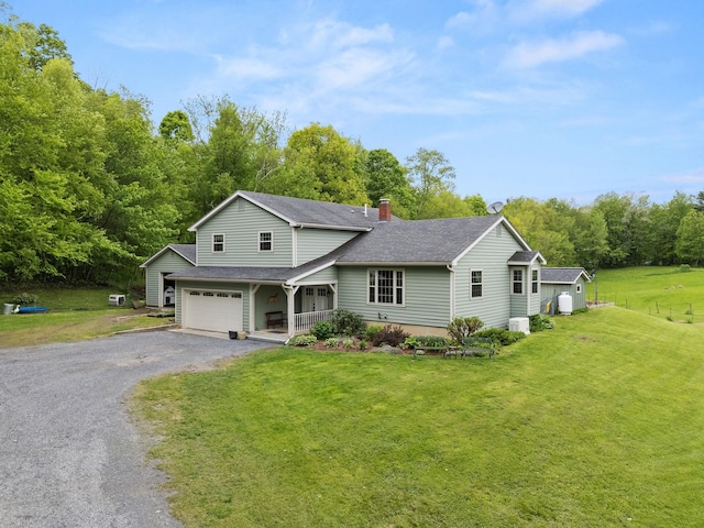 55 Honey Hill Rd, Hinesburg, VT 05461 - traditional-style house with driveway, covered porch, a front yard, an attached garage, and a chimney