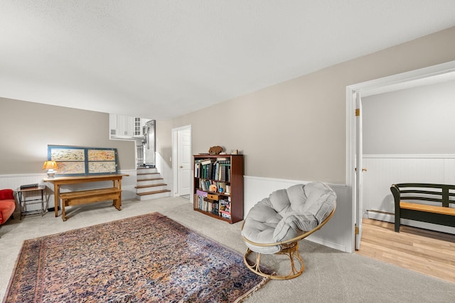 55 Honey Hill Rd, Hinesburg, VT 05461 - living room with wainscoting, carpet flooring, and stairway