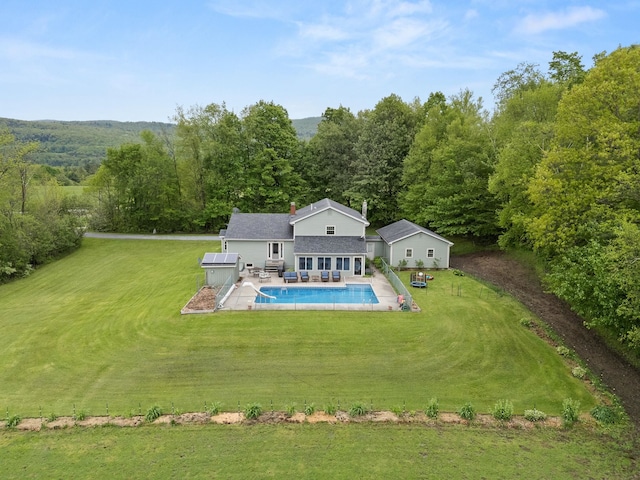55 Honey Hill Rd, Hinesburg, VT 05461 - back of house featuring a lawn, an outdoor pool, a view of trees, and a patio area