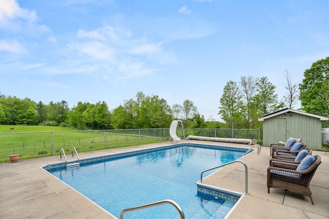 55 Honey Hill Rd, Hinesburg, VT 05461 - view of swimming pool featuring a water slide, an outdoor structure, and a patio