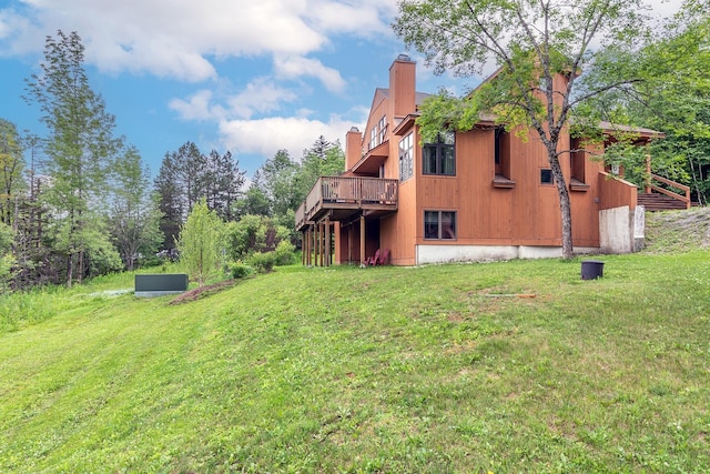 46 Willows Way Unit 5, Peru, VT 05152 - back of property featuring a chimney, a lawn, and a wooden deck