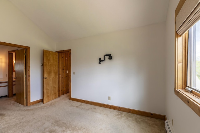 46 Willows Way Unit 5, Peru, VT 05152 - unfurnished bedroom featuring lofted ceiling, carpet floors, a baseboard radiator, and baseboards