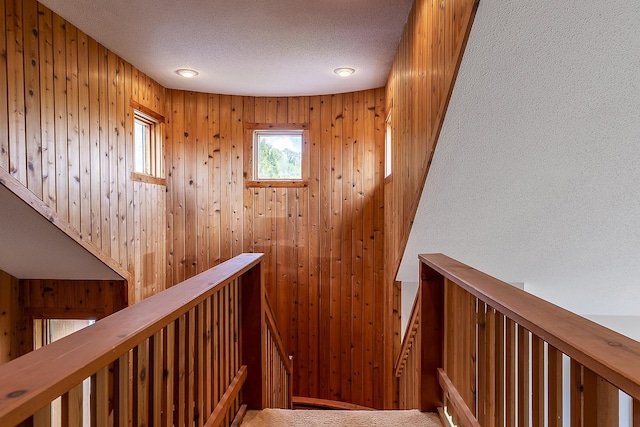 46 Willows Way Unit 5, Peru, VT 05152 - staircase featuring a textured ceiling and wood walls