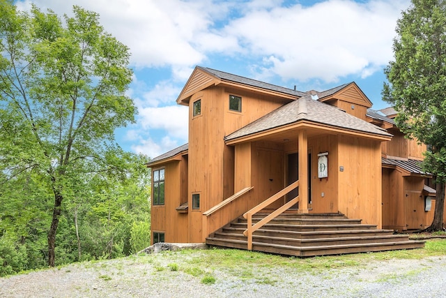 46 Willows Way Unit 5, Peru, VT 05152 - view of front of house featuring a shingled roof and a standing seam roof