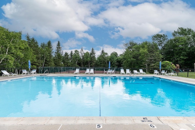 46 Willows Way Unit 5, Peru, VT 05152 - community pool with a patio and view of wooded area
