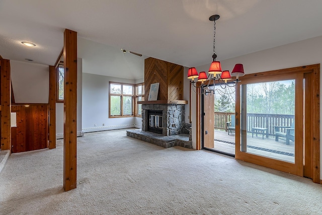 46 Willows Way Unit 5, Peru, VT 05152 - unfurnished living room featuring carpet flooring, a chandelier, baseboards, a fireplace, and baseboard heating