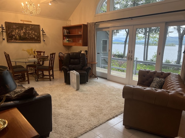 87 Chase Point Rd, Tuftonboro, NH 03853 - tiled living area featuring lofted ceiling, a chandelier, french doors, and a water view