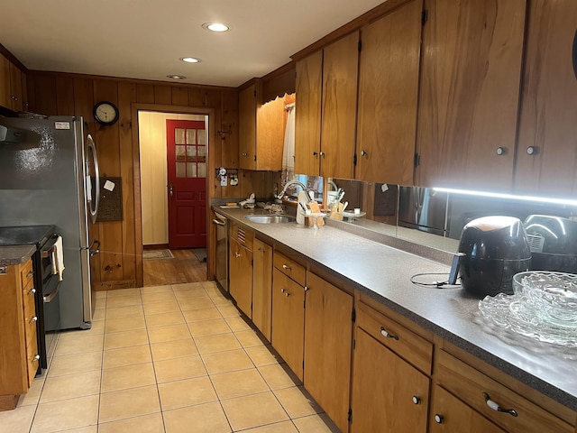 87 Chase Point Rd, Tuftonboro, NH 03853 - kitchen with a sink, double oven range, stainless steel dishwasher, brown cabinetry, and recessed lighting