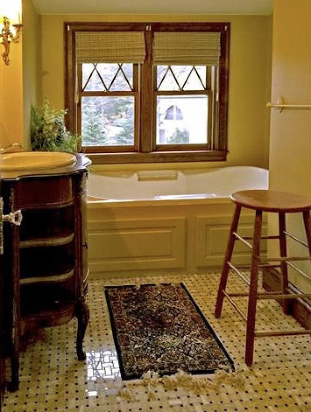 34 Baker Ave, Deerfield, NH 03037 - bathroom with healthy amount of natural light, vanity, and a garden tub