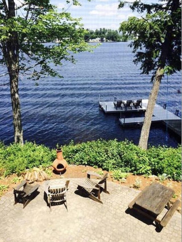 34 Baker Ave, Deerfield, NH 03037 - dock area featuring an outdoor fire pit, a water view, and a patio