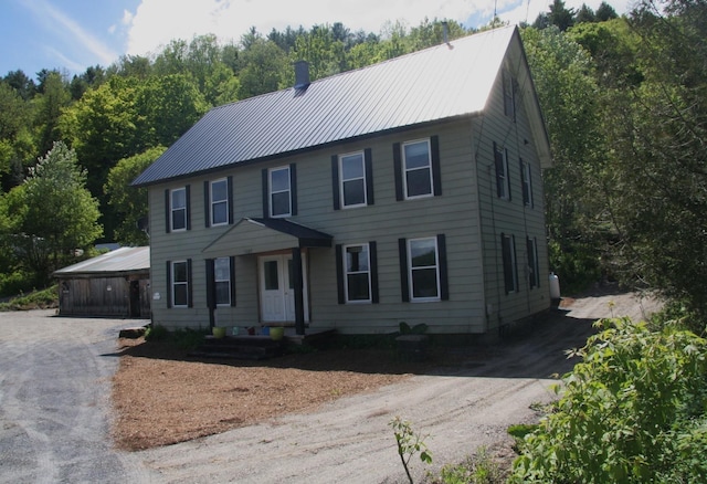 1083 Back Center Rd, Lyndon, VT 05851 - colonial house featuring metal roof and a chimney