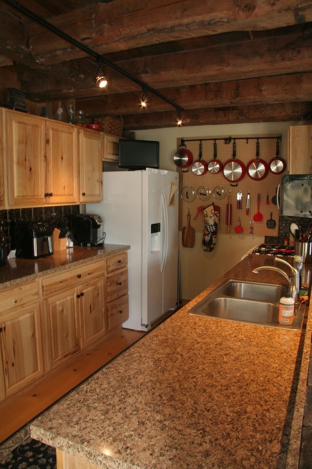 1083 Back Center Rd, Lyndon, VT 05851 - kitchen featuring white refrigerator with ice dispenser, a sink, track lighting, and light brown cabinetry