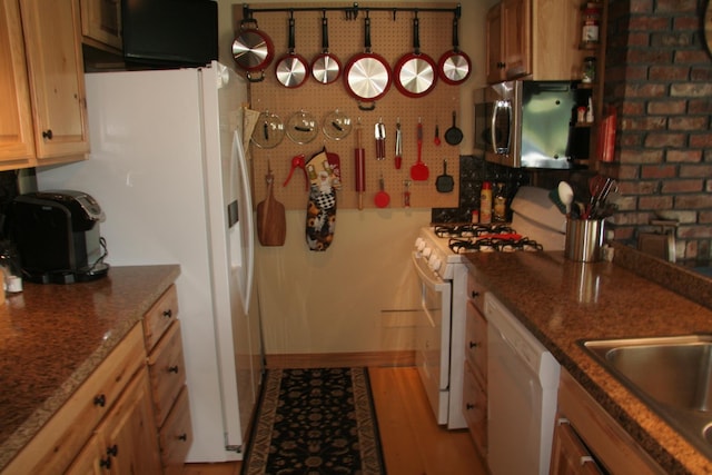 1083 Back Center Rd, Lyndon, VT 05851 - kitchen featuring white appliances, light wood-style flooring, and a sink
