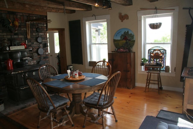 1083 Back Center Rd, Lyndon, VT 05851 - dining space with light wood finished floors, beamed ceiling, and baseboards