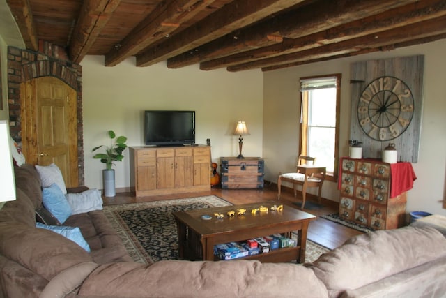 1083 Back Center Rd, Lyndon, VT 05851 - living area with wood finished floors, baseboards, and wood ceiling with exposed beams