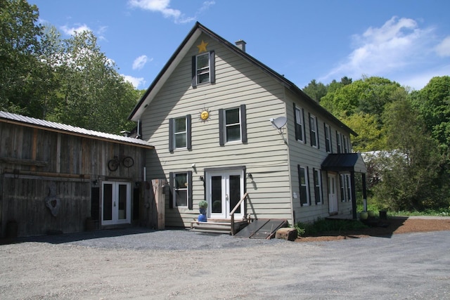 1083 Back Center Rd, Lyndon, VT 05851 - back of house with french doors and entry steps