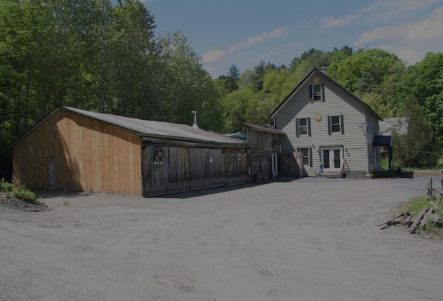 1083 Back Center Rd, Lyndon, VT 05851 - back of house featuring french doors