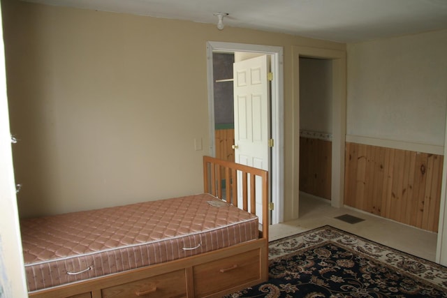 1083 Back Center Rd, Lyndon, VT 05851 - bedroom featuring wooden walls and wainscoting