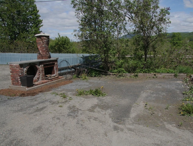 1083 Back Center Rd, Lyndon, VT 05851 - view of patio featuring an outdoor brick fireplace