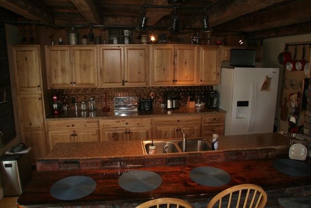 1083 Back Center Rd, Lyndon, VT 05851 - bar area featuring white fridge with ice dispenser, a sink, backsplash, and beamed ceiling