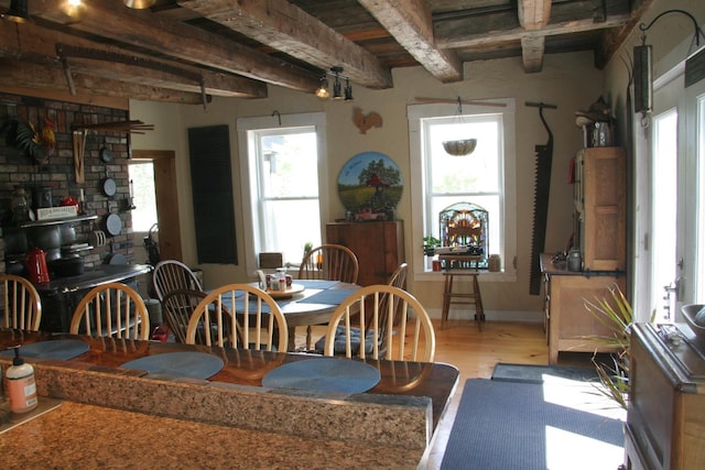 1083 Back Center Rd, Lyndon, VT 05851 - dining area with light wood-style flooring and beamed ceiling
