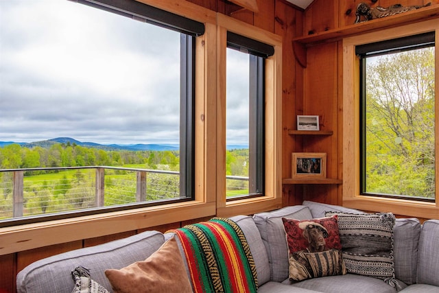 304 Green Bay Loop, Peacham, VT 05862 - living room featuring wooden walls, plenty of natural light, and a mountain view