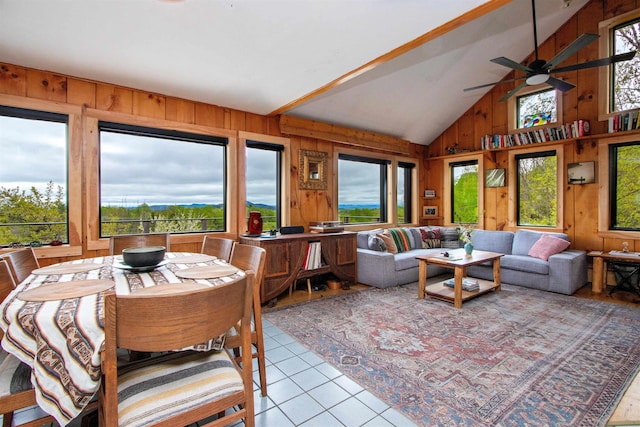 304 Green Bay Loop, Peacham, VT 05862 - tiled dining room featuring wooden walls, lofted ceiling, and a ceiling fan