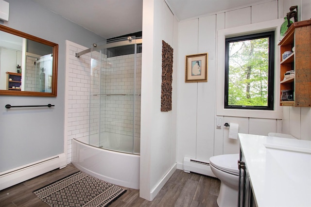 304 Green Bay Loop, Peacham, VT 05862 - bathroom featuring a baseboard radiator, vanity, toilet, and wood finished floors
