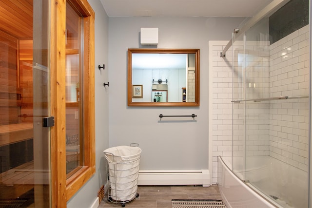 304 Green Bay Loop, Peacham, VT 05862 - bathroom with baseboard heating, enclosed tub / shower combo, a sauna / steam room, wood finished floors, and baseboards