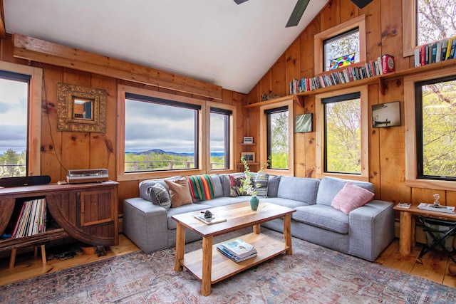 304 Green Bay Loop, Peacham, VT 05862 - living room featuring hardwood / wood-style floors, healthy amount of natural light, wooden walls, and high vaulted ceiling