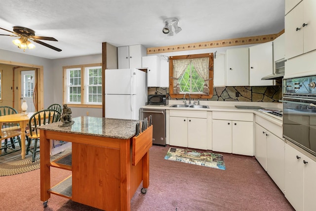 124 Hanson Rd, Ossipee, NH 03864 - kitchen featuring white appliances, a sink, a ceiling fan, carpet flooring, and white cabinetry