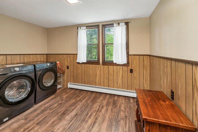 124 Hanson Rd, Ossipee, NH 03864 - laundry room featuring a baseboard radiator, wainscoting, independent washer and dryer, wood finished floors, and wood walls