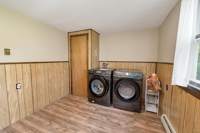 124 Hanson Rd, Ossipee, NH 03864 - laundry area with independent washer and dryer, a baseboard radiator, wainscoting, wood walls, and wood finished floors