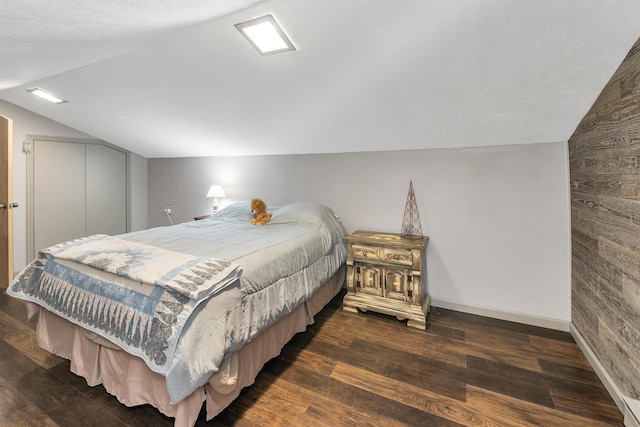 124 Hanson Rd, Ossipee, NH 03864 - bedroom with lofted ceiling, wood finished floors, and baseboards