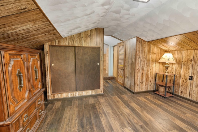 124 Hanson Rd, Ossipee, NH 03864 - additional living space featuring lofted ceiling, wooden walls, wood finished floors, and baseboards