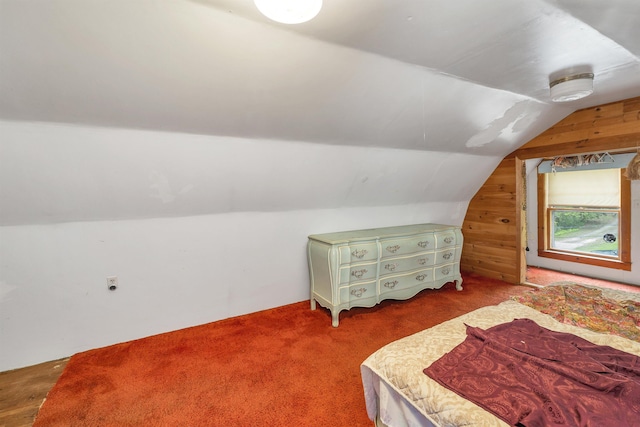 124 Hanson Rd, Ossipee, NH 03864 - bedroom featuring lofted ceiling, wooden walls, and carpet