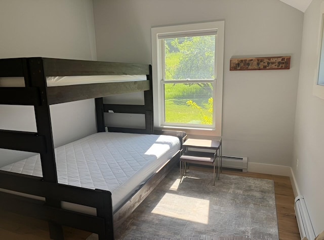1186 Pucker St Unit 1.5Acres, Stowe, VT 05672 - bedroom featuring wood finished floors, a baseboard heating unit, lofted ceiling, and baseboards