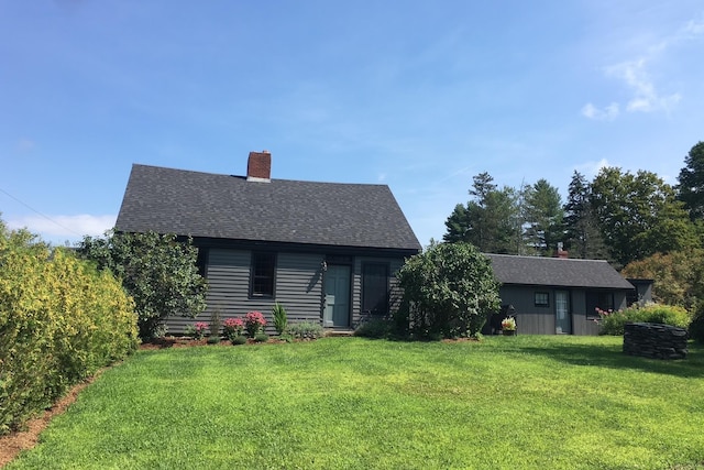 1186 Pucker St Unit 1.5Acres, Stowe, VT 05672 - back of house featuring a lawn, a chimney, and a shingled roof