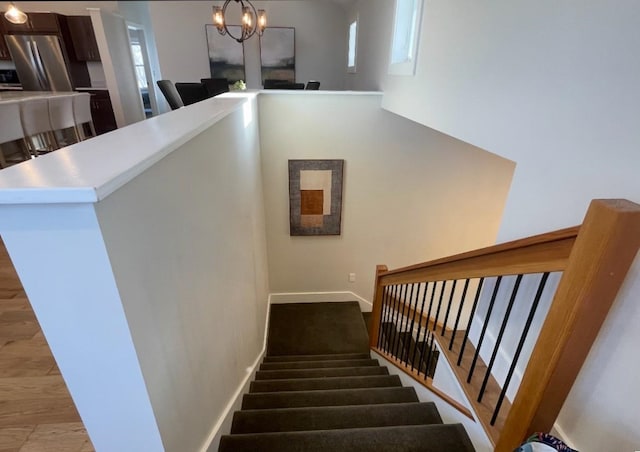 1186 Pucker St Unit 1.5Acres, Stowe, VT 05672 - stairs with a chandelier, wood finished floors, and baseboards