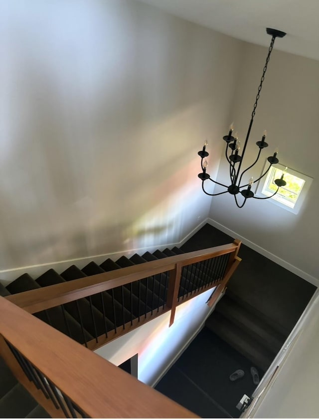 1186 Pucker St Unit 1.5Acres, Stowe, VT 05672 - stairway featuring a chandelier and baseboards