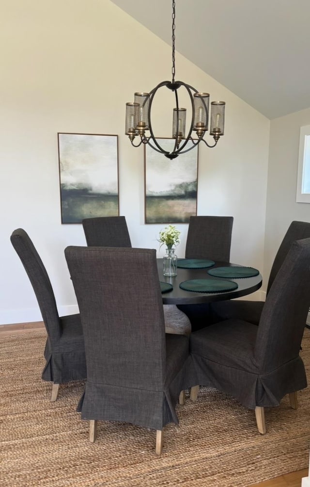 1186 Pucker St Unit 1.5Acres, Stowe, VT 05672 - dining area featuring a chandelier, vaulted ceiling, baseboards, and carpet floors