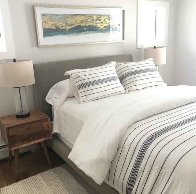 1186 Pucker St Unit 1.5Acres, Stowe, VT 05672 - bedroom featuring wood finished floors and multiple windows